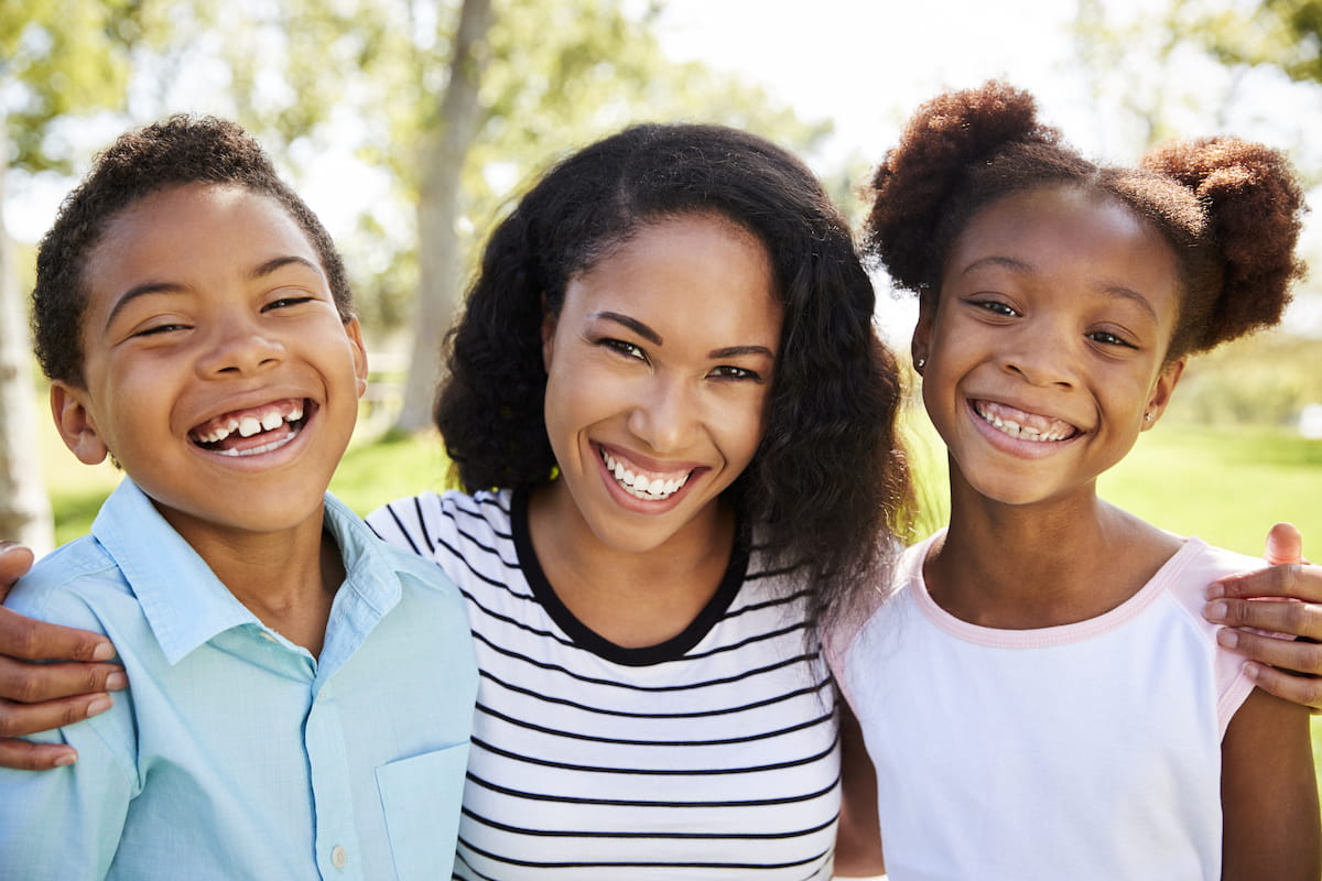 Smiling African American mom and kids